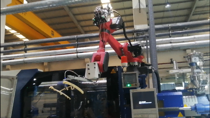 Robot work with injection machine Robot work with injection machine